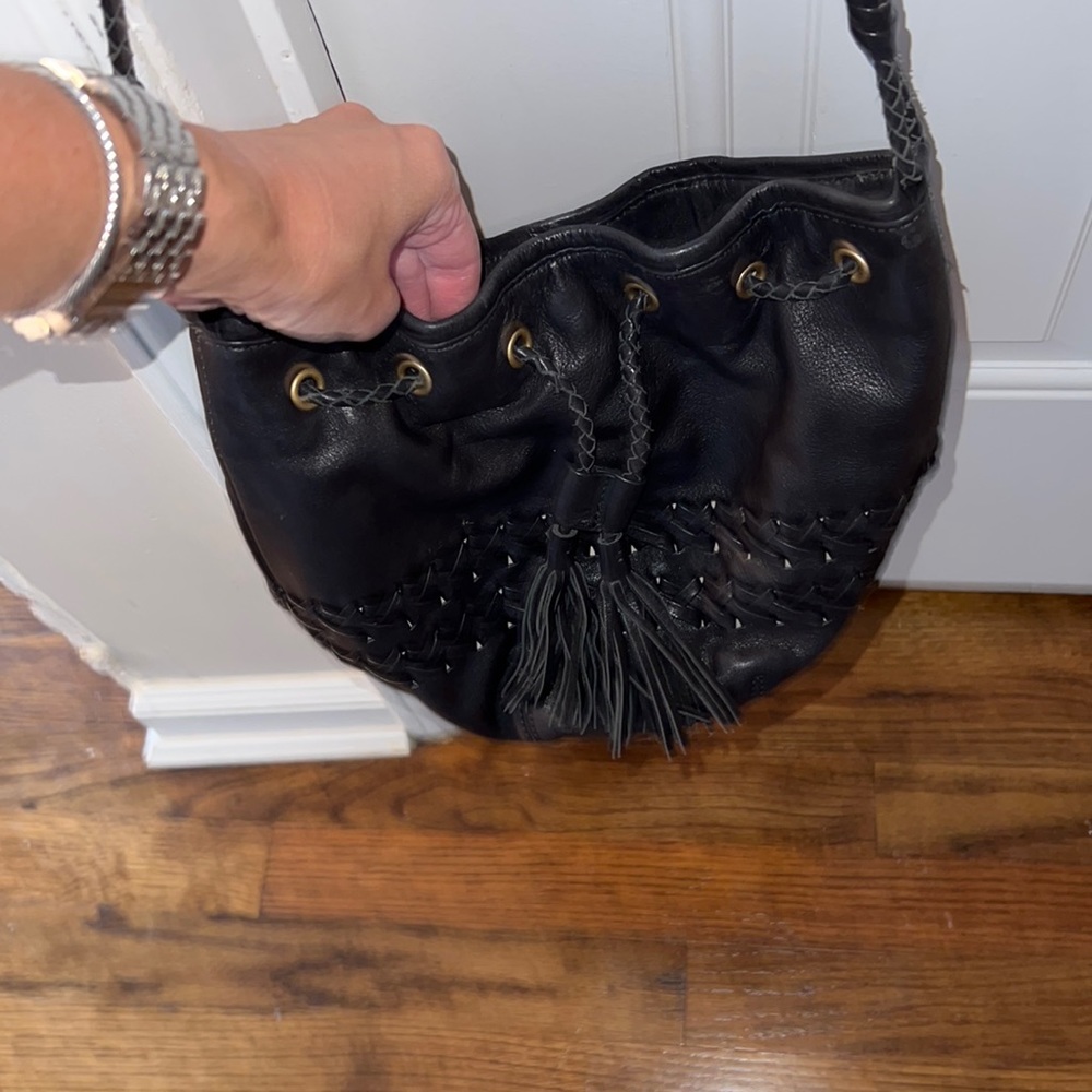 Black leather crossbody bag with tassel and braided leather
